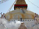 Kathmandu Boudhanath 13 Boudhanath Stupa Entrance Steps, Elephants, Kiln A pair of elephants and a kiln used to burn juniper welcomes you at the entrance to the Boudhanath Stupa itself near Kathmandu. The elephant rider at the left brandishes a sword and shield.